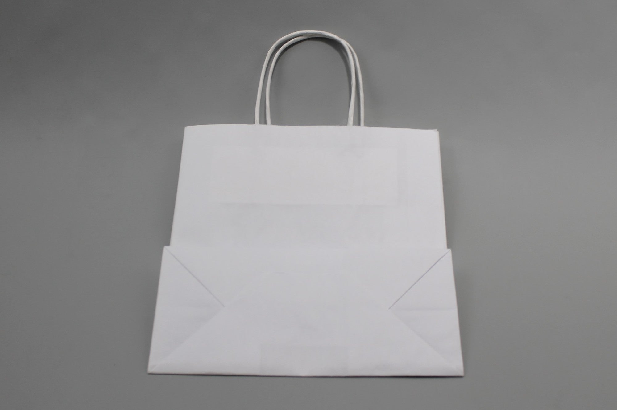Paper Carrier Bags White 26x12x35cm Kraft 90 g/gm with twisted handles (50 pieces) [PAMW2635]